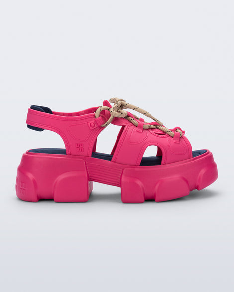 side view of a pink Camp platform sandal with beige laces and accents