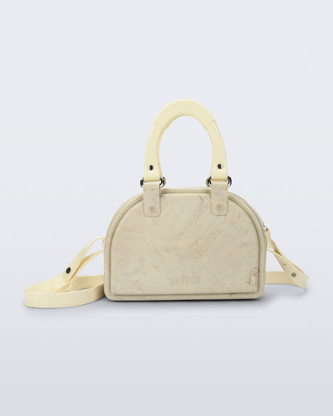 Front view of a beige Bowling bag with handle strap and cross body strap