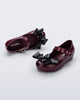 Top and angled view of a pair of burgundy Ultragirl Classy baby flats with black bow