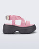 Side view of a pink Stand platform sandal with dark grey sole