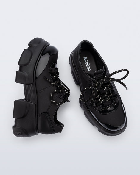Top and side view of a pair of black Camp platform Sneakers with black laces