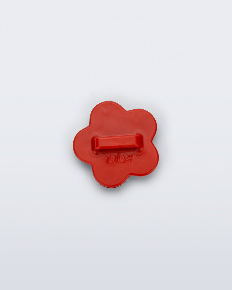 Back view of a red flower shoe charm