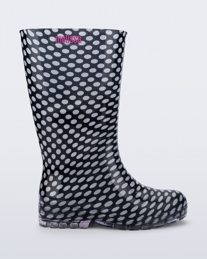 Side view of a black with white polka dots Welly rain boot