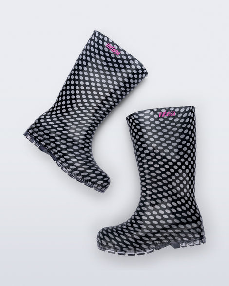 Top view of a pair of black with white polka dots Welly rain boots
