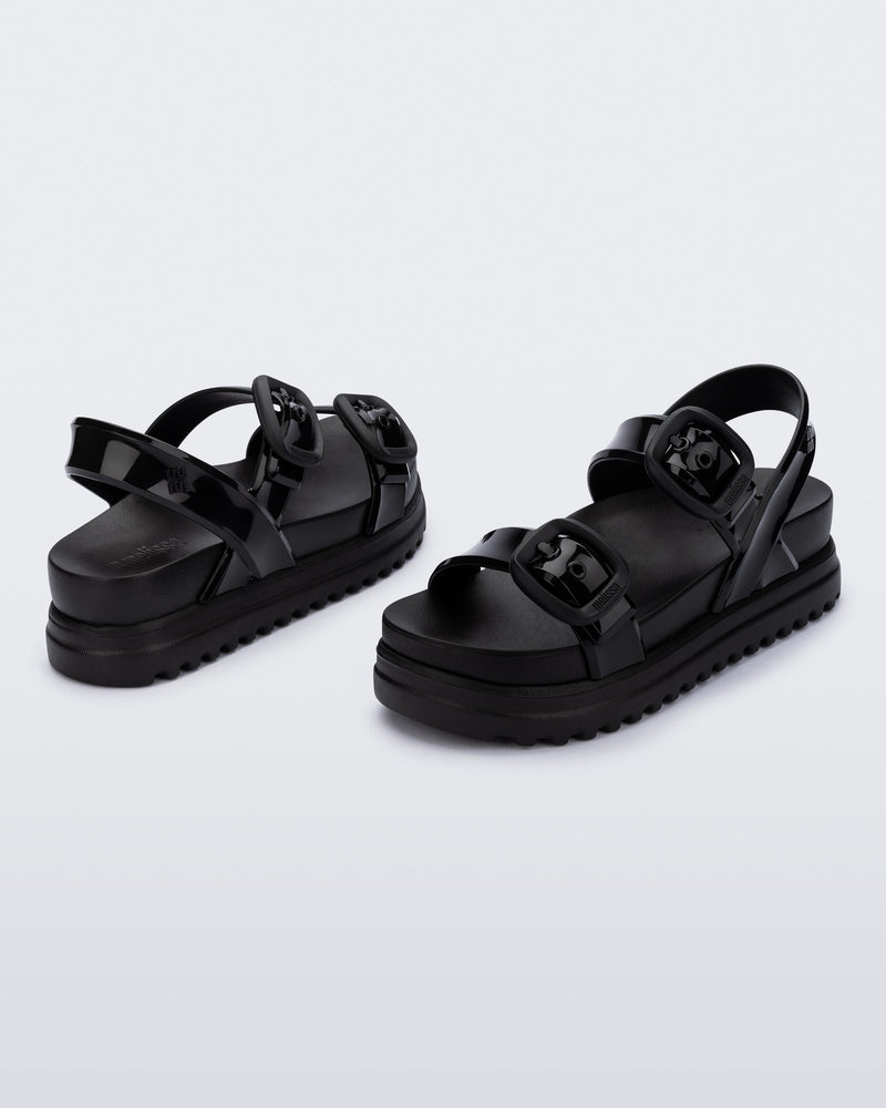 Back and angled view of a pair of black Cozy Sandal Platforms