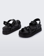 Back and angled view of a pair of black Cozy Sandal Platforms