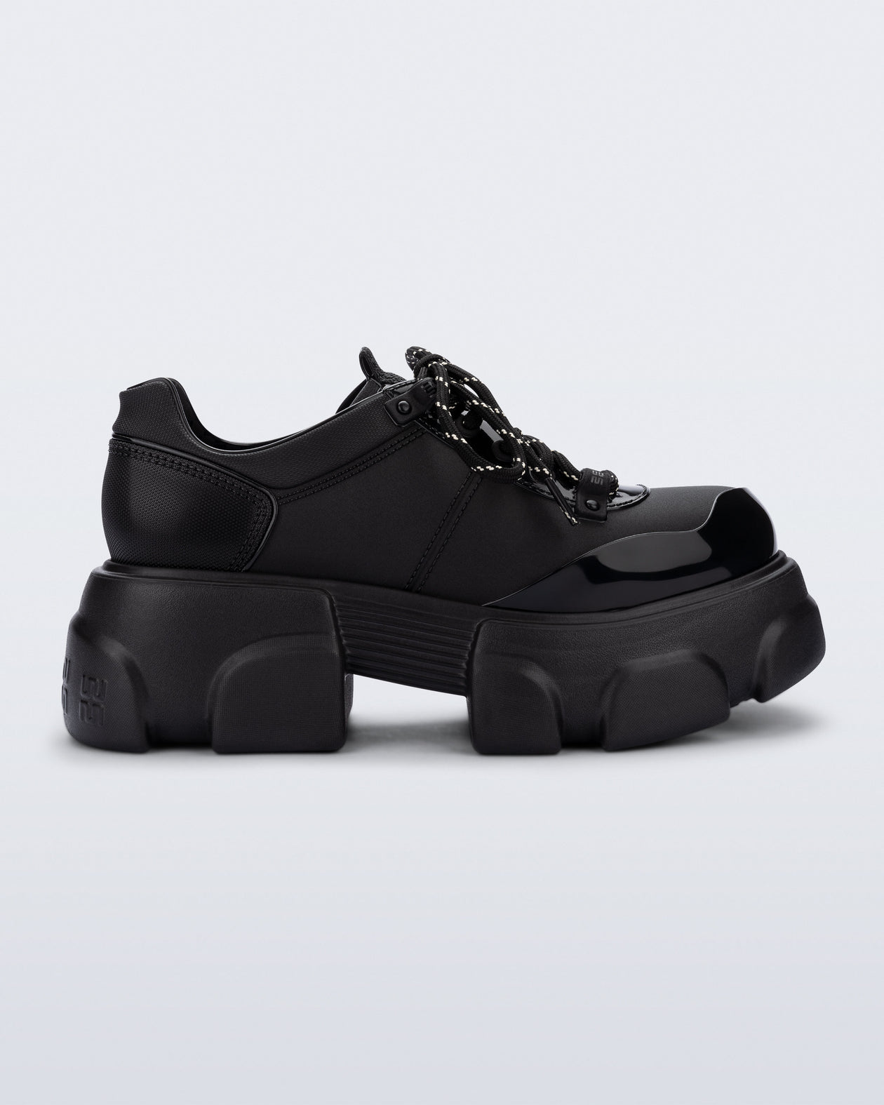 Side view of a black Camp platform Sneaker with black laces