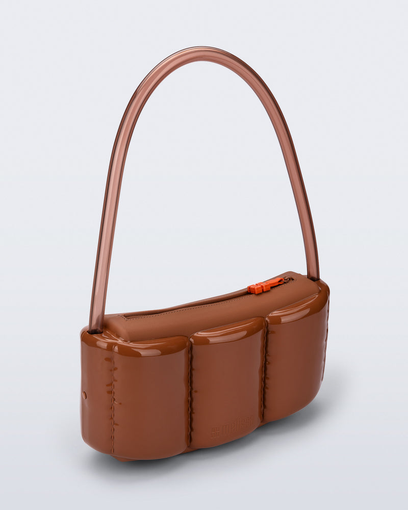 Angled view of a brown Airflow bag with clear brown shoulder strap