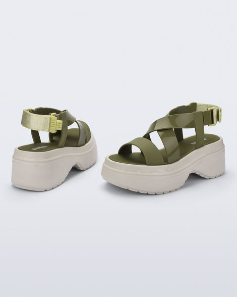 back and angled view of a pair of beige Stand platform sandals with army green straps