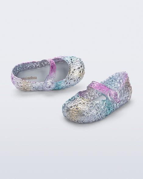 Top and angled view of a pair of pearly blue Pollen baby flats