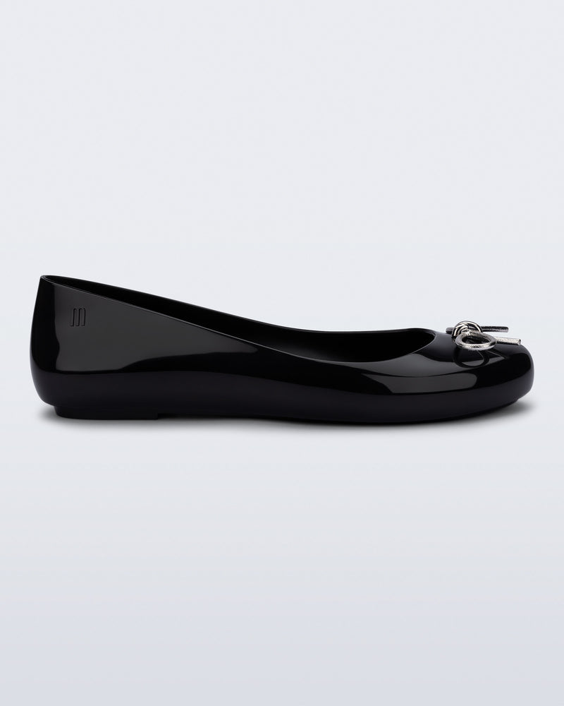 Side view of a black Sweet Love Chrome flat with silver bow