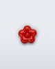 Front view of a red flower shoe charm
