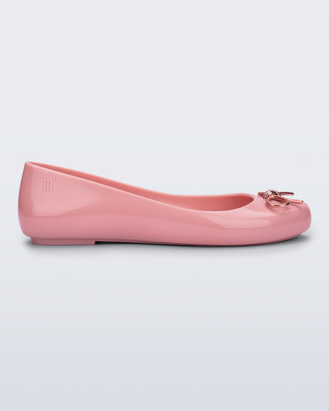 Side view of a pink Sweet Love Chrome flat with metallic pink bow