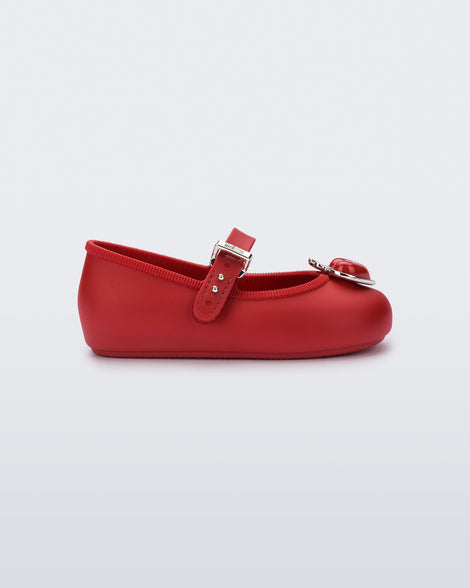 Side view of a red Soft Ballerina Princess baby flat with a red heart on top