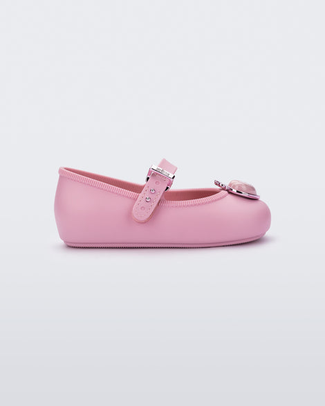 Side view of a pink Soft Ballerina Princess baby flat with a pink heart on top
