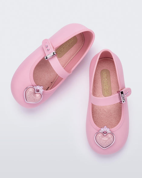 Top view of a pair of pink Soft Ballerina Princess baby flats with a pink heart on top