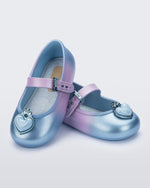 Angled view of a pair of blue/lilac Soft Ballerina Princess baby flats with a blue heart on top
