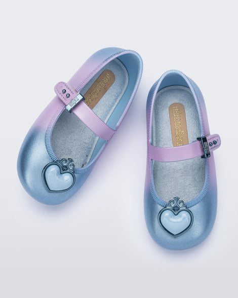 Top view of a pair of blue/lilac Soft Ballerina Princess baby flats with a blue heart on top