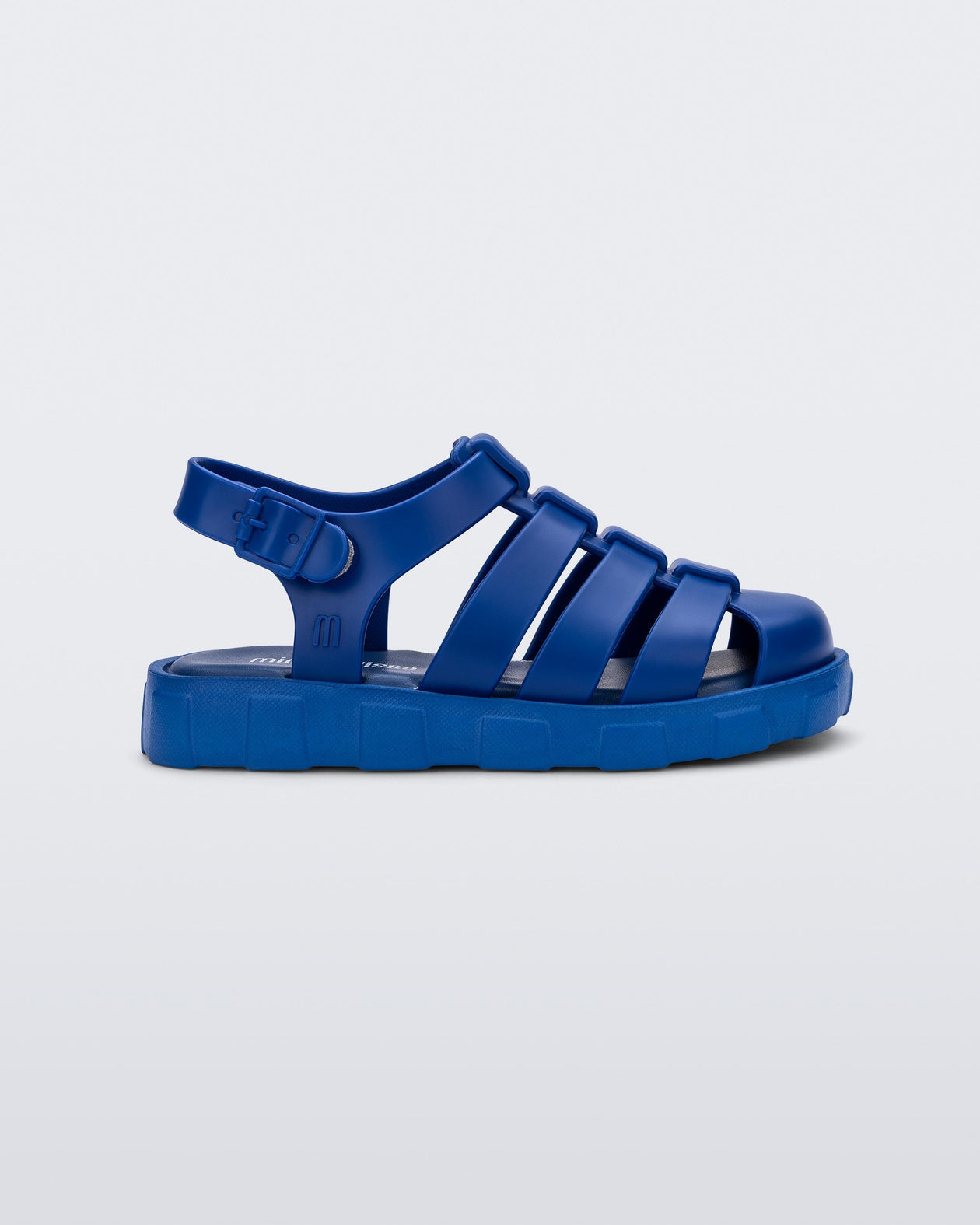 Side view of a blue Megan baby sandal.