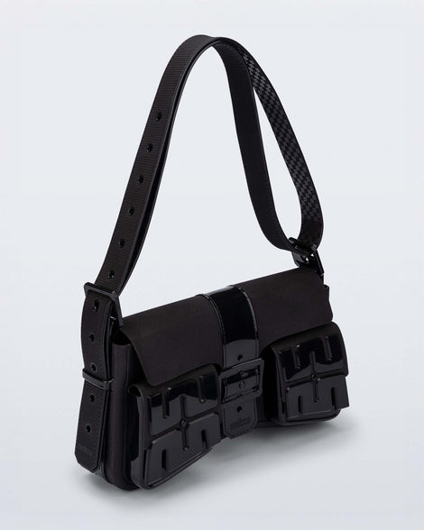 Angled view of a black Cargo bag with two small pockets on the front and an adjustable strap