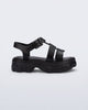Side view of a black Ella kids sandal with heel strap