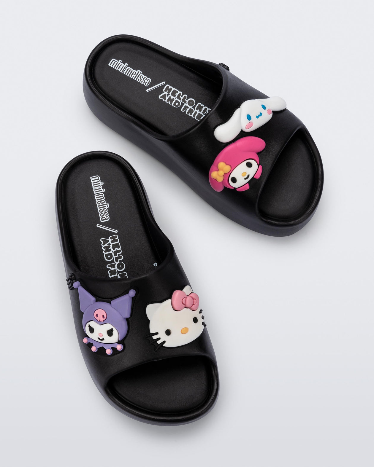 Top view of a pair of black Free Platform slides + Hello Kitty and Friends kids sandals with Hello Kitty and Friends on upper