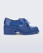 Side view of a blue Tailor loafer with laces