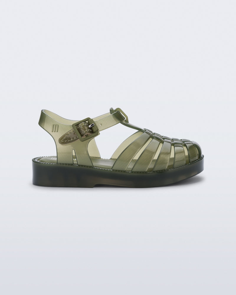 Side view of a clear green Possession baby sandal