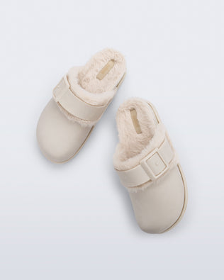 Top view of a pair of beige Cozy Warm Clogs with fuzzy insoles