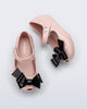 Top and side view of a pair of pink Ultragirl Classy baby ballerina flats with black bow