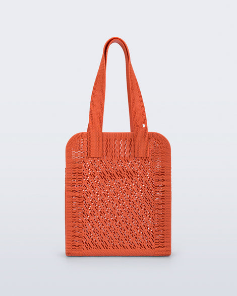 Back view of an orange Harper bag with shoulder straps