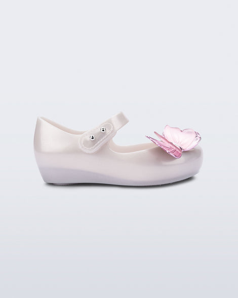 Side view of a pearly white Ultragirl Butterfly baby flat with pink butterflies on top