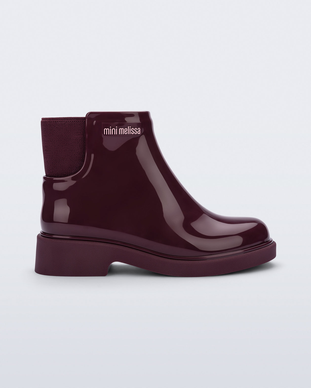 Side view of a burgundy Chelsea II kids boot