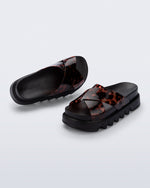 Top and angled view of a pair of black/tortoise Cozy Cross platform sandals with crisscross top straps