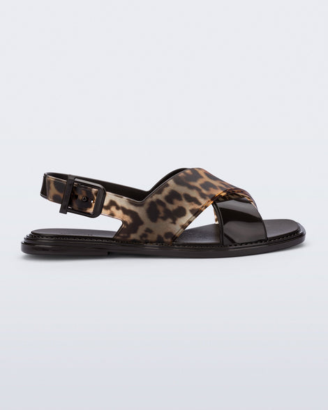 Side view of a brown/tortoise Cleo sandal with back strap and crisscross top straps
