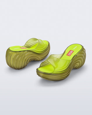 Side and back angled view of a pair of clear yellow Quantum Platform sandals
