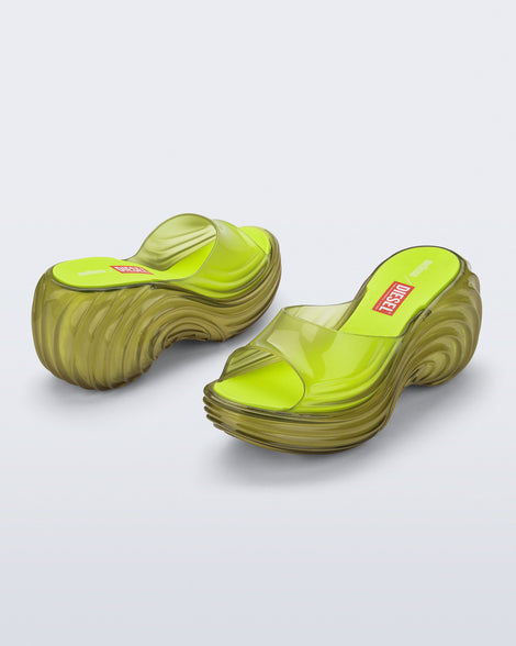 Side and back angled view of a pair of clear yellow Quantum Platform sandals
