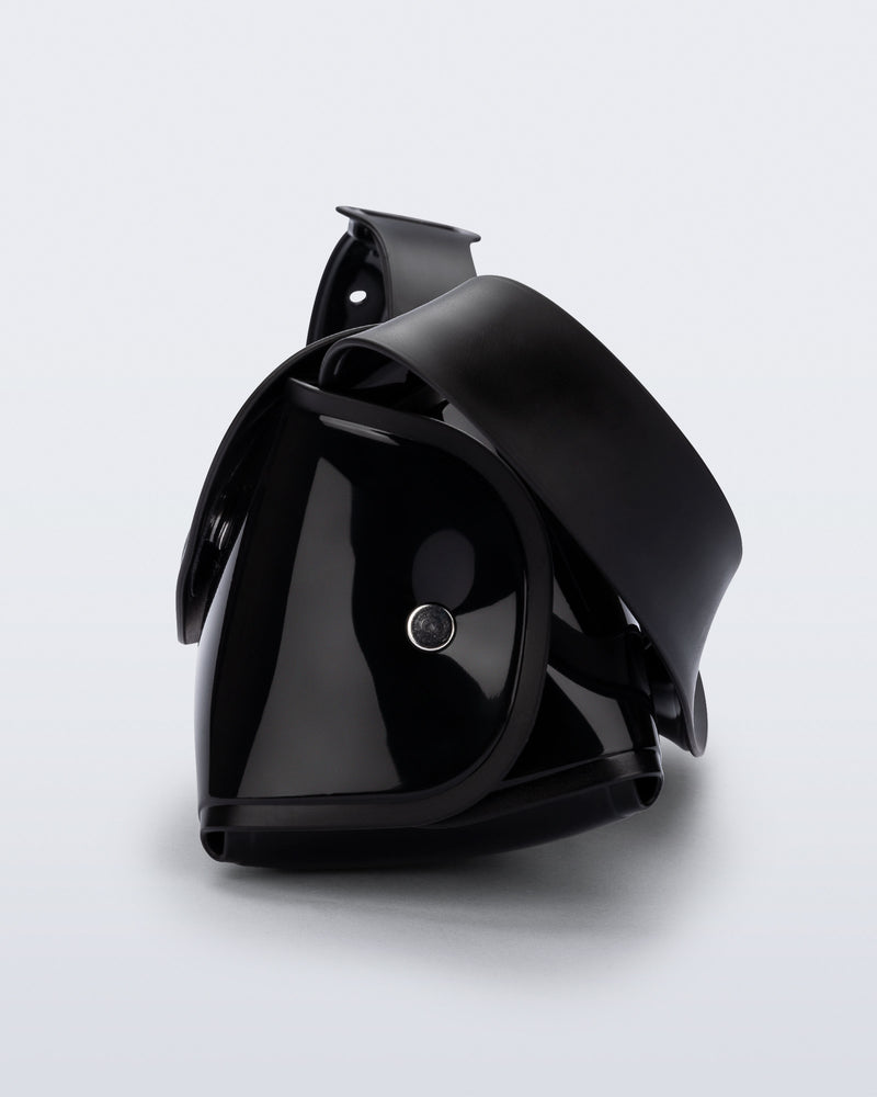 Side view of a black Cross Bag with adjustable strap