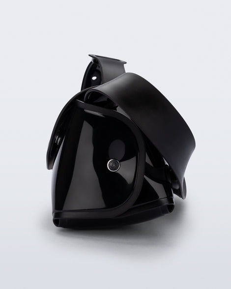 Side view of a black Cross Bag with adjustable strap