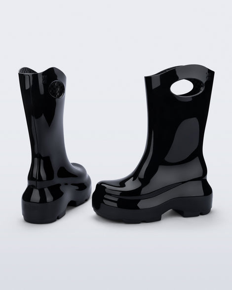 Back and side view of a pair of black Ultra platform rain Boot with circle cutout on top