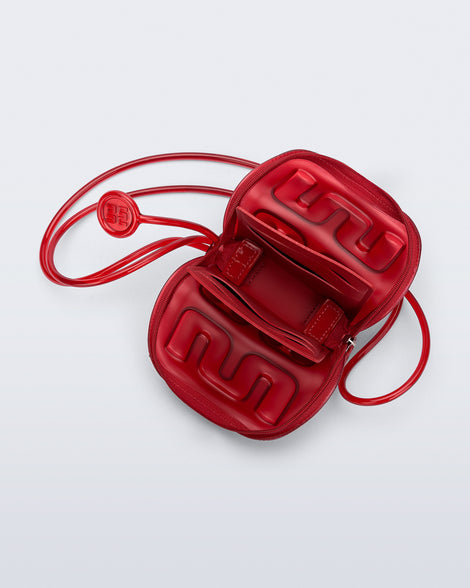 Top view of a red Jelly Wallet with inside pocket and zipper