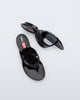 Top and side view of a pair of black Flip Flop + Diesel sandals