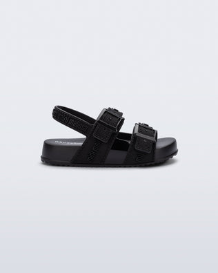 Side view of a black Cozy M Lover baby sandal