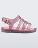 Side view of a pink/glitter silver Flox baby sandal