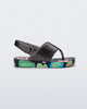 Side view of a black glitter Shiny baby sandals with multicolor sole