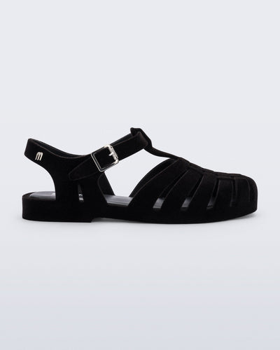 Side view of a flocked black Possession Velvet fisherman sandal