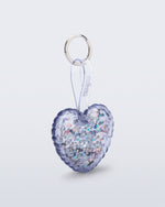 Angled view of a clear with glitter Heart bag charm