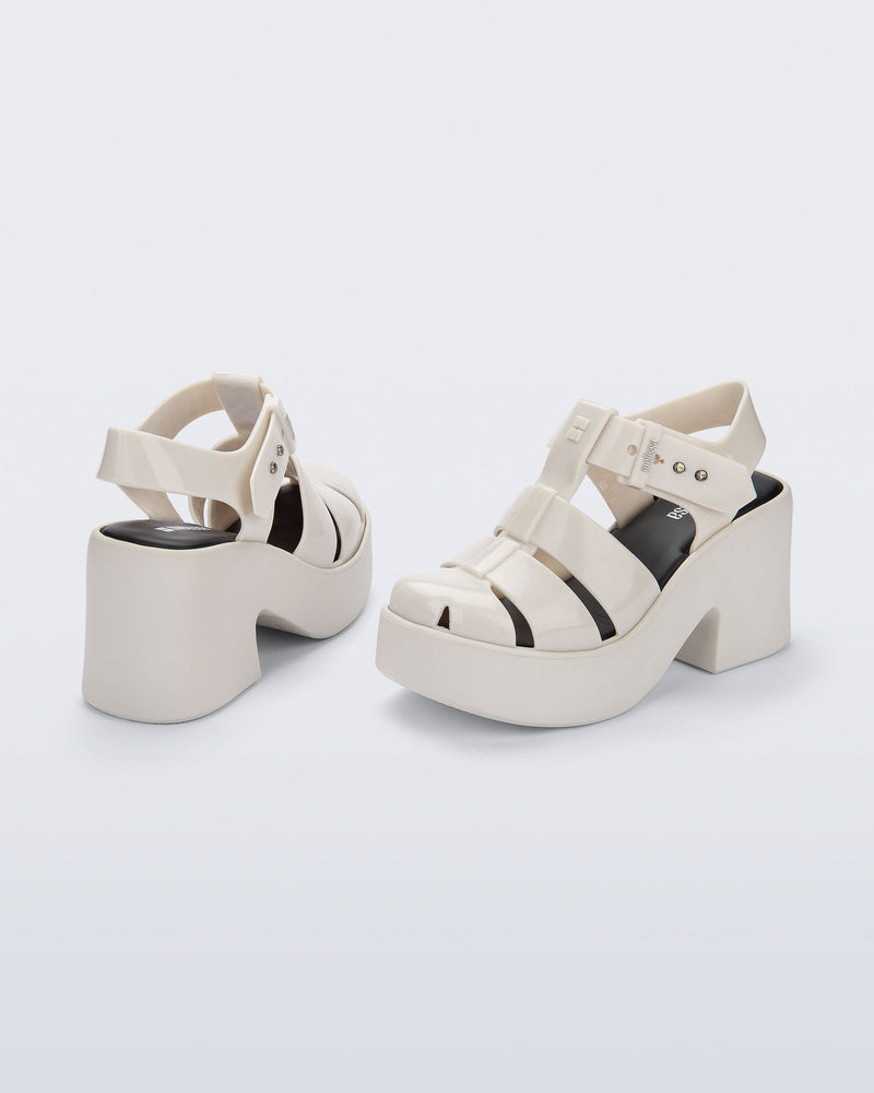 Back and side view of a pair of beige Lulu platform heel fisherman sandals