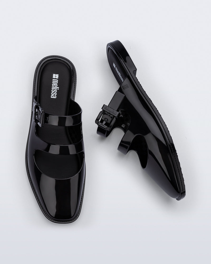 Side and top view of a pair of black Anastasia mule slides