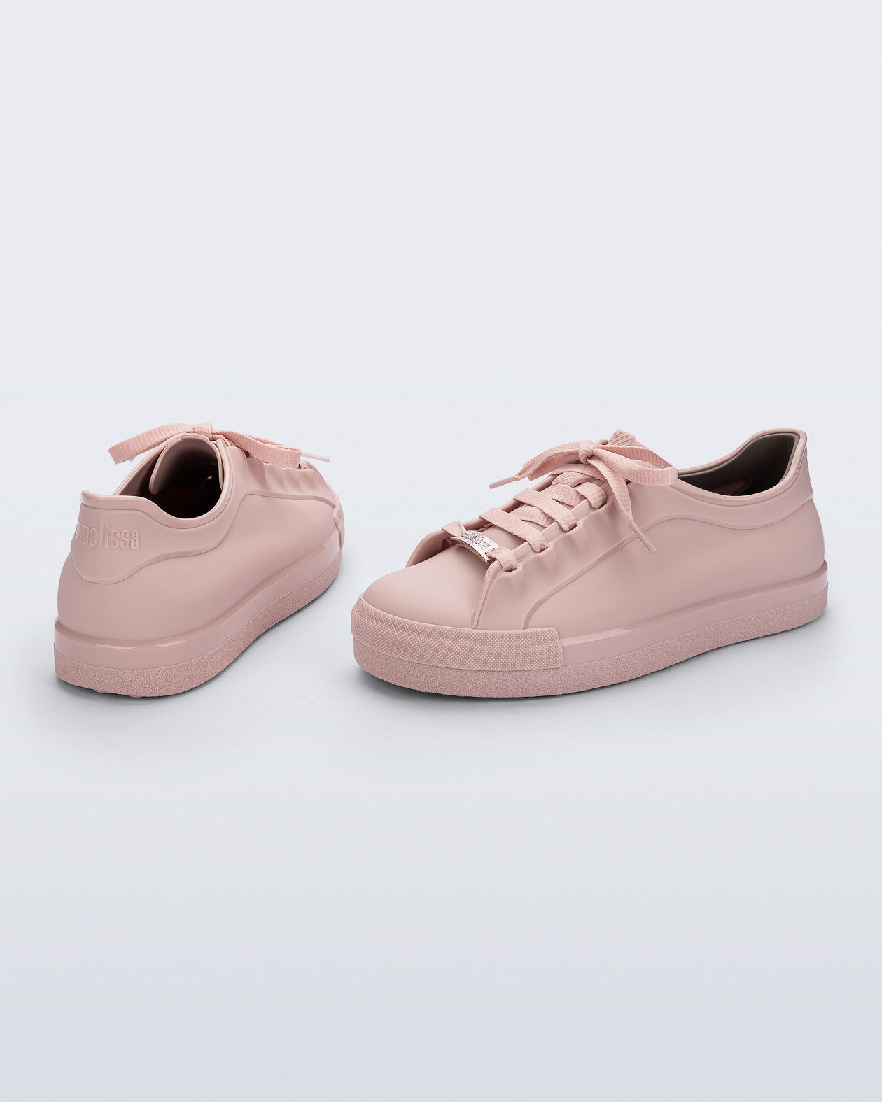 Back and angled view of a pair of pink Wow Sneakers with pink laces